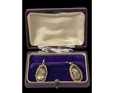 Pair gold and silver inlaid earrings.