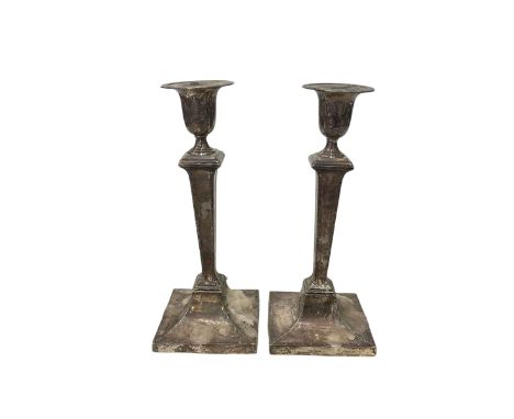 Pair silver candlesticks with husk borders, loaded, 27cm, Sheffield mark rubbed, circa 1900.