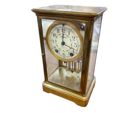 Brass and four glass mantel clock with enamel dial and mercurial pendulum.