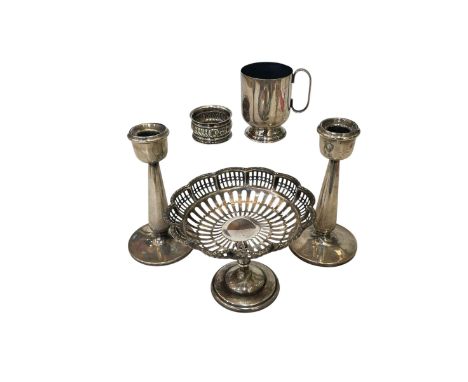 Silver bon bon dish, Birmingham 1912, silver loaded candlesticks, Chester 1909, silver napkin ring, and EP christening mug (4