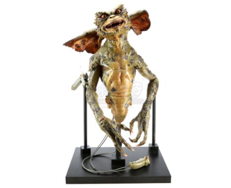 A green gremlin puppet from Joe Dante's comedy horror sequel Gremlins 2: The New Batch. A horde of vile gremlins wreaked havo