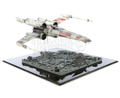 An ICONS X-Wing fighter replica model from the promotion of George Lucas' Star Wars: A New Hope. The X-Wings were instrumenta