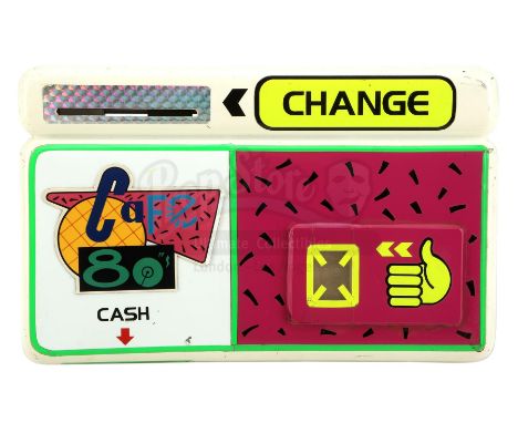 A light-up Cafe 80's payment device from Robert Zemeckis' sci-fi adventure sequel Back to the Future Part II. In 2015, Marty 