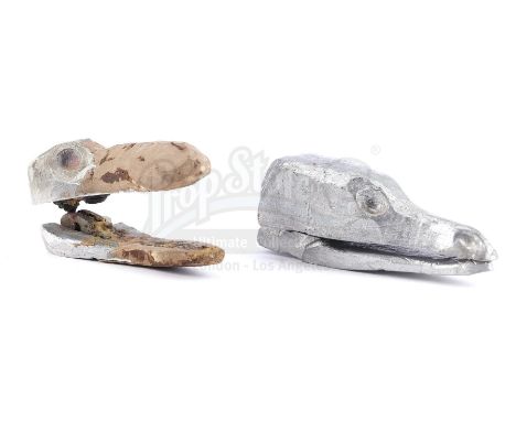 A pair of Vermithrax Pejorative armature head casts from Matthew Robbins' and Hal Barwood's fantasy film Dragonslayer. After 