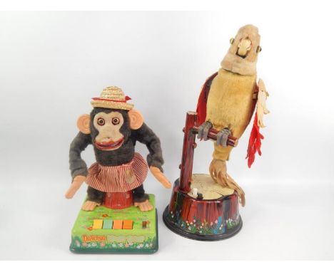 A Louis Marx branded parakeet automaton, with a CK Japanese branded dancing merry chimp automaton, 46cm and 33cm high respect