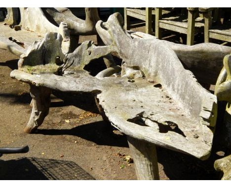 A two seater driftwood bench.