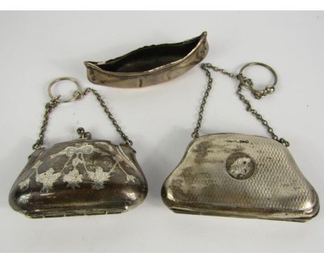 A George V silver purse, with engine turned decoration, reserve initial, Birmingham 1915, another with engraved bow and swags