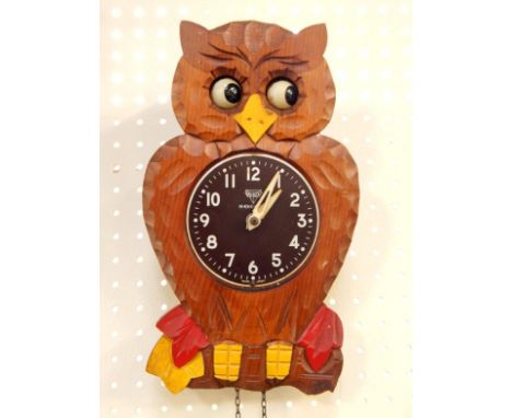 A Mi-Ken carved wood novelty owl wall clock, 26cm long, and a Black Forest cuckoo clock, (2).