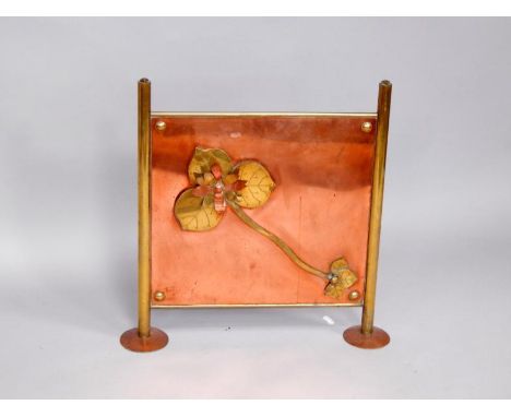 An Arts and Crafts copper and brass fire screen, decorated to the front with a single flower, raised on pad feet, 57cm x 57cm
