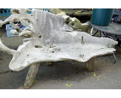 A two seater driftwood bench.