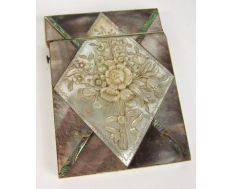 A Victorian mother of pearl and abalone card case, in a diamond parquet design with a central panel relief decorated with a b