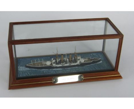 A scale model of an ironclad battleship HMS Triumph, cased with name plate, 28 x 12½ x 12cm.