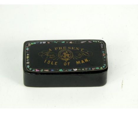 A German papier mache snuff box, decorated to the lid with A Present from the Isle of Man, 9cm x 4.5cm x 2cm.