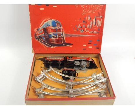 A Distler battery operated train set, the engine named The Flyer, sold with tender, carriage, some track, in original box wit
