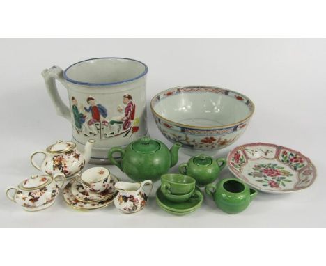 A Staffordshire pottery frog mug,  mid 19thC, relief moulded with tavern scenes, 12cm high, child's green pottery tete-a-tete