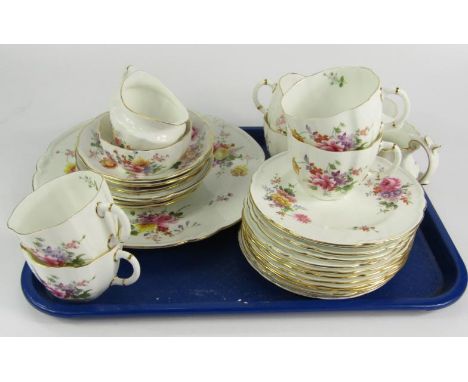 A Royal Crown Derby porcelain part tea service, decorated in the Derby Posies pattern, comprising bread plate, two cream jugs