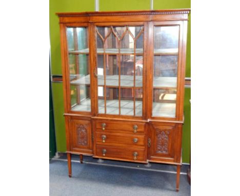 A Victorian oak breakfront display cabinet, the dentil moulded pediment over a central glazed door enclosing two shelves, abo