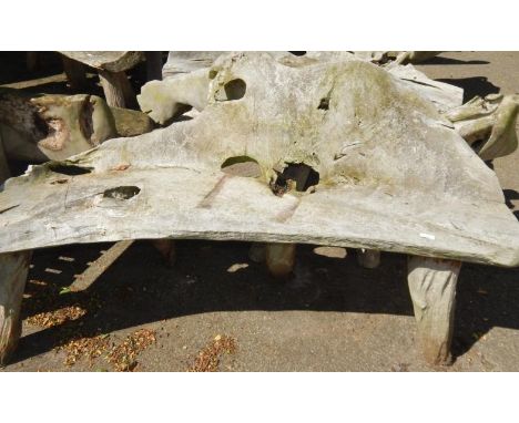 A two seater driftwood bench.