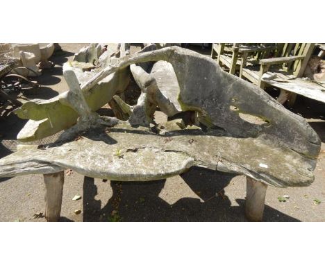 A two seater driftwood bench.