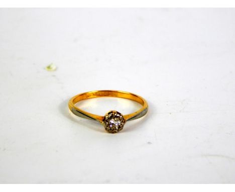 An 18ct gold platinum and diamond solitaire ring, illusion set, size K, 1.5g.