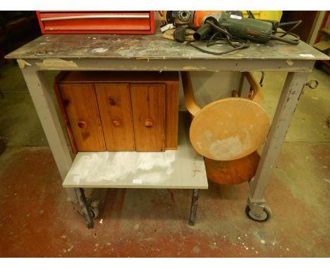 A metal work bench, on castors. Viewing: Tuesday 12th July 10am to 4pm Grangeway Road Wigston LE18 1JE. Collection by arrange