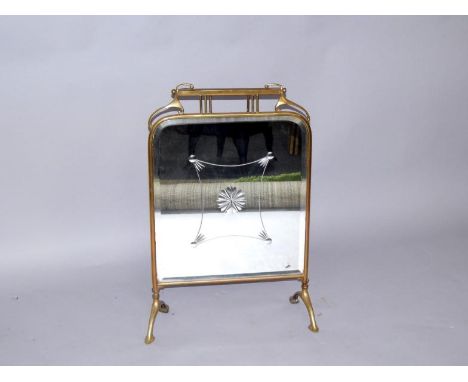 An Art Nouveau brass fire screen, inset engraved and bevelled glass, 71cm x 49.5cm.