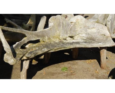 A two seater driftwood bench.