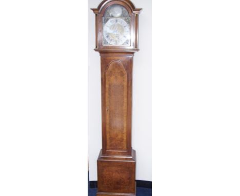 A walnut cased longcase clock, early 20thC, the brass broken arch dial with silvered chapter ring bearing Roman numerals and 