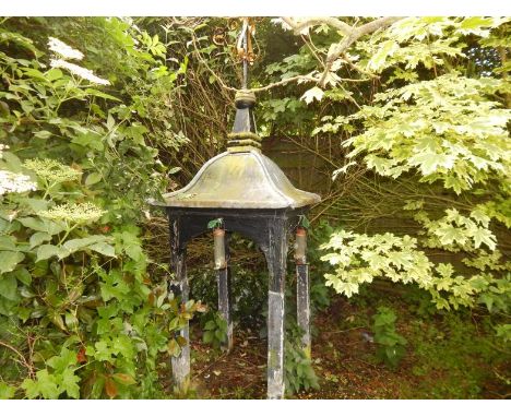 A wooden pergola, with a lead roof and black and gold painted cast iron weather vane. Viewing on site: Tattershall, Lincolnsh