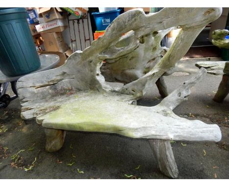 A two seater driftwood bench.