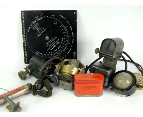 Aircraft memorabilia, including a Reflector Sight Mk III W, cockpit lamp, Mark 1A, Bombing Angle Computor, and an Oxygen Regu