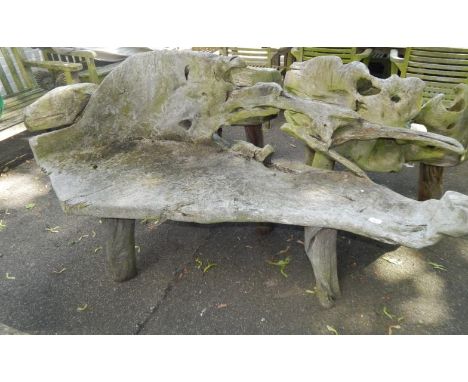 A two seater driftwood bench.