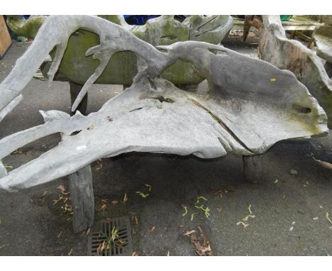 A two seater driftwood bench.