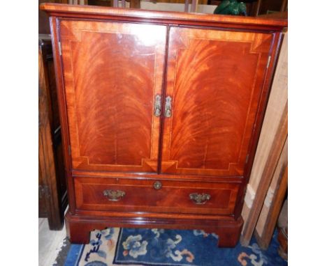 A mahogany and satinwood inlaid cabinet, with two doors above a frieze drawer, raised on bracket feet, 77cm x 47.5cm x 95cm.