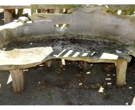 A two seater driftwood bench.