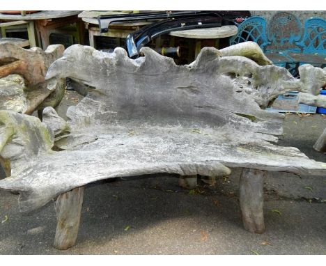 A two seater driftwood bench.