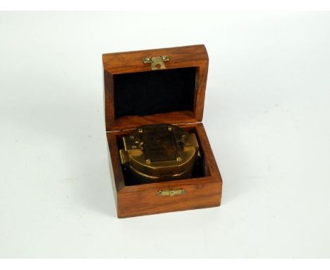 A Stanley compass, with Natural Sine chart to lid, wooden cased, 6.5cm diameter.