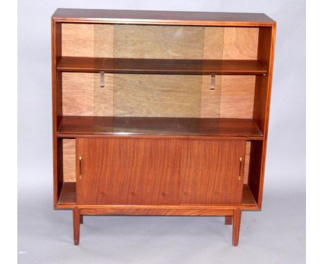 A 1960s teak display cabinet, with two sliding glass doors, opening to reveal a shelf, cupboard below, raised on square taper