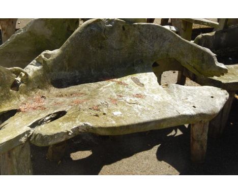 A two seater driftwood bench.
