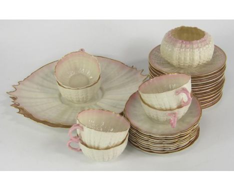 A Belleek porcelain part tea service, decorated in the Tridacna pattern, 2nd black mark, comprising of a pair of bread plates