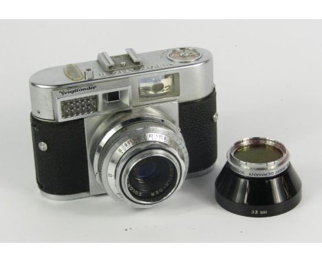 A Voigtlander Vitematic II camera, with a Stopar 1:2.8/50 lens, and further lenses, cased.