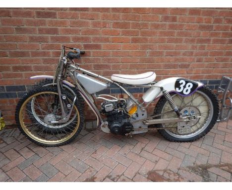 A Dirt Track or Speedway bike, with Honda petrol engine with spare wheel and two exhaust pipes, etc. Viewing: Tuesday 12th Ju