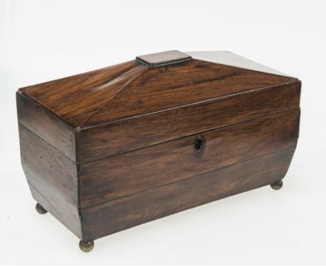 A REGENCY ROSEWOOD SARCOPHAGUS FORM CADDY, the hinged top opening to reveal three ivory handled lidded compartments raised on