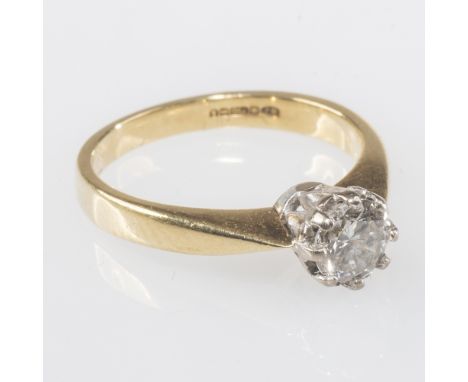 A SOLITAIRE DIAMOND RING, the round brilliant-cut stone weighing 0.50 carats claw-set on a tapering 18ct yellow gold band. Ri