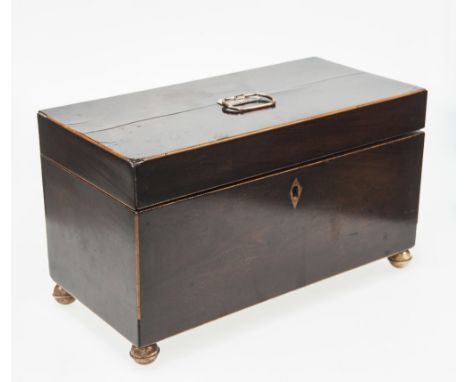 A GEORGE III MAHOGNAY CADDY, the hinged rectangular top opening to reveal a central glass liner flanked by twin ivory handled