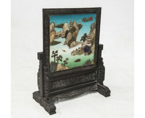 A CHINESE HARDSTONE MOUNTED TABLE SCREEN, c. 1900, the square panel decorated with a pagoda and pavilions on rocky islands ag