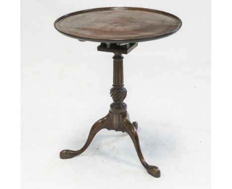 A GEORGE III MAHOGANY TILT-TOP TRIPOD TABLE, the dished circular top over a bird cage above a turned and fluted tapering stan