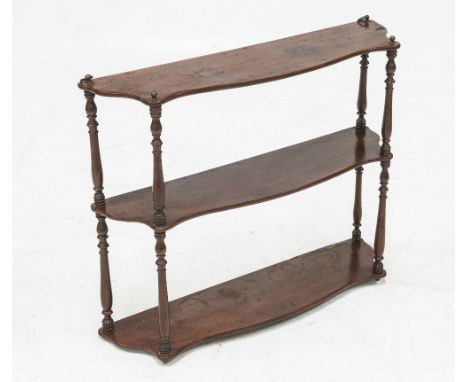 A THREE TIER MAHOGANY HANGING SHELF, the shaped shelf sections supported by turned uprights and with brass finials. 0.53 by 0