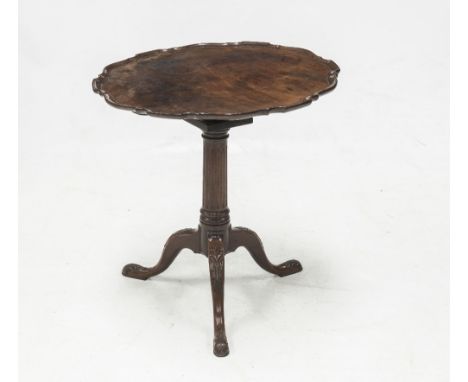 A HANDSOME GEORGE III MAHOGANY TILT TOP TRIPOD TABLE, the dished 'pie-crust' circular top over a bird cage above a fluted tap