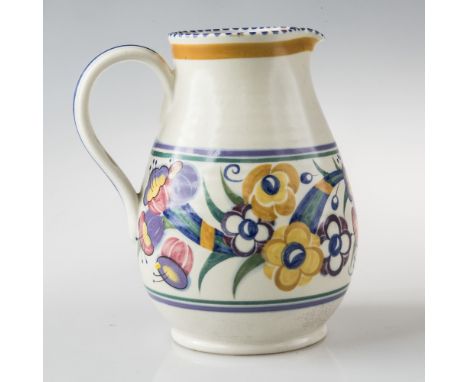A POOLE POTTERY JUG, decorated with a band of stylised flowers, bears Poole pottery impressed mark, printed marks and pattern